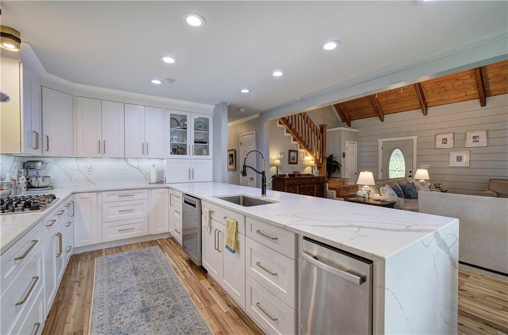 566 Old Grade Road Resaca, GA 30735 - Photo 9 of 48 a kitchen with a sink stove and cabinets