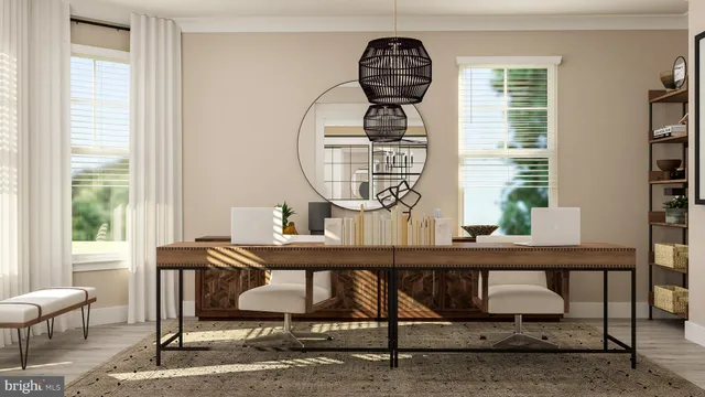 a view of hall way with furniture and window