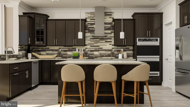 a kitchen with stainless steel appliances a sink and a refrigerator
