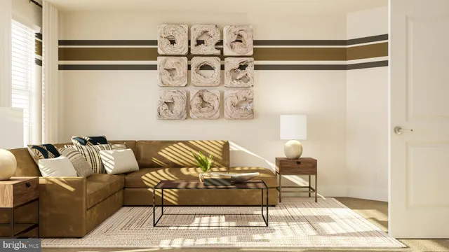 a living room with furniture and painting on the wall