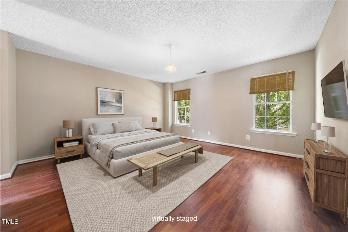 5305 Corinthian Way Raleigh, NC 27607 - Photo 11 of 21 a spacious bedroom with a bed and a window