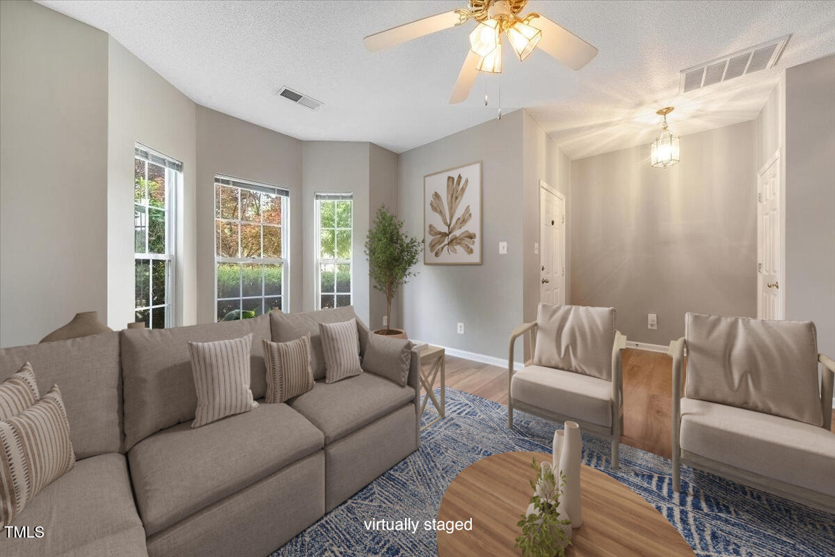 5305 Corinthian Way Raleigh, NC 27607 - Photo 5 of 21 a living room with furniture and a large window