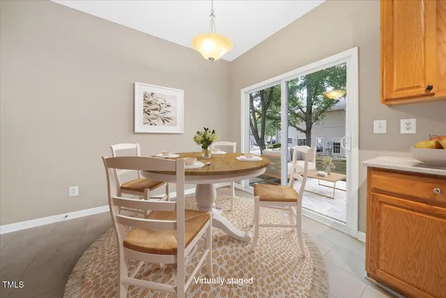 a dining room with a table and chairs