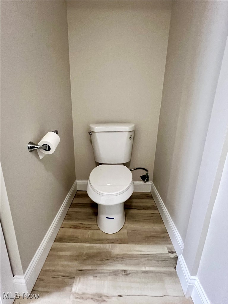 2972 North Turkeyfoot Road Akron, OH 44319 - Photo 16 of 32 Bathroom with light wood-style floors and baseboards