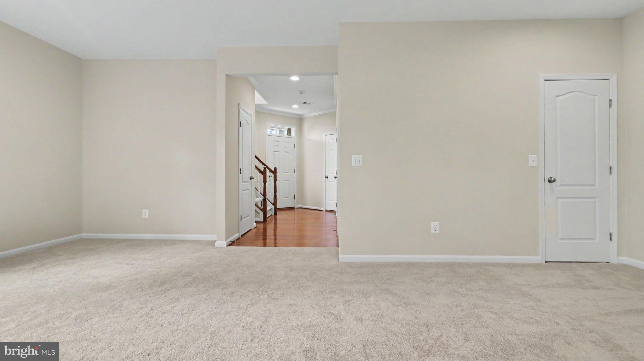42371 Trellis Square Brambleton, VA 20148 - Photo 11 of 70 Spacious entryway with warm tones.