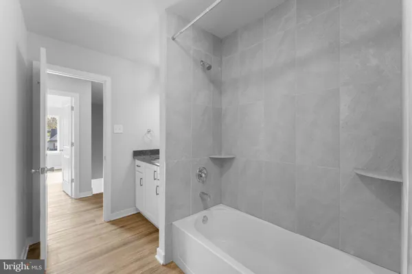 a bathroom with a bathtub and a shower