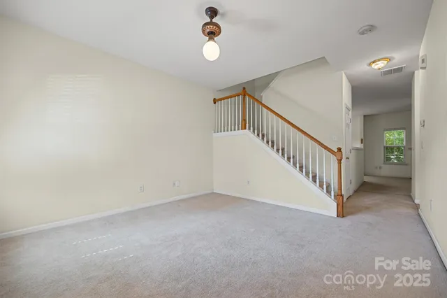 a view of a hallway with staircase