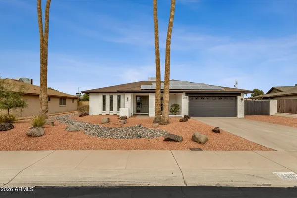 a front view of a house with street view