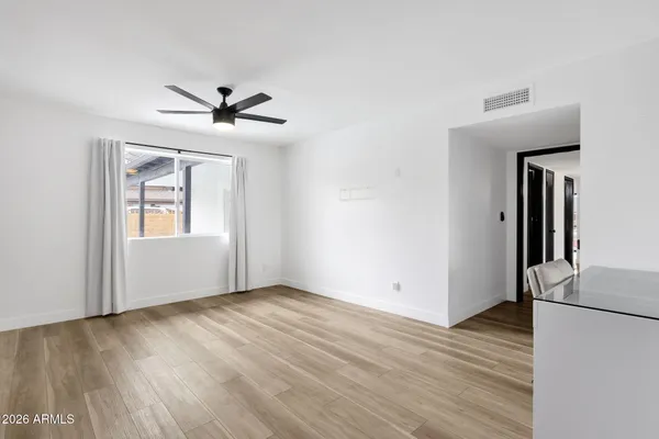 a view of a hallway to a bedroom
