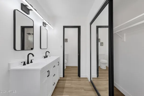 a bathroom with a shower and a mirror