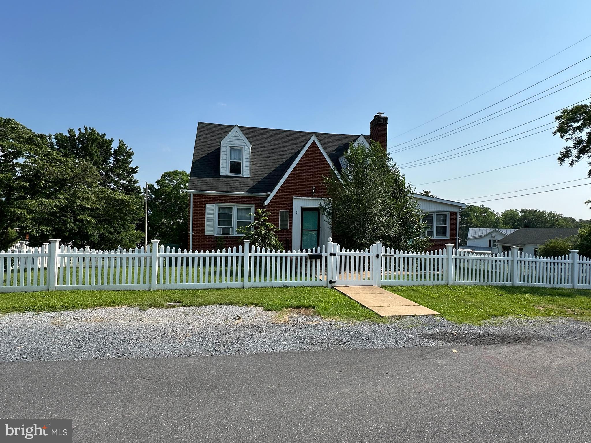 a view of a house with a swimming pool and a yard