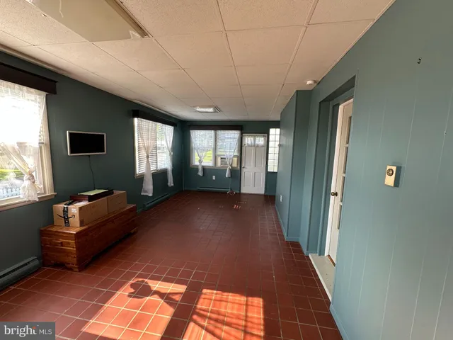 a view of livingroom with furniture and windows