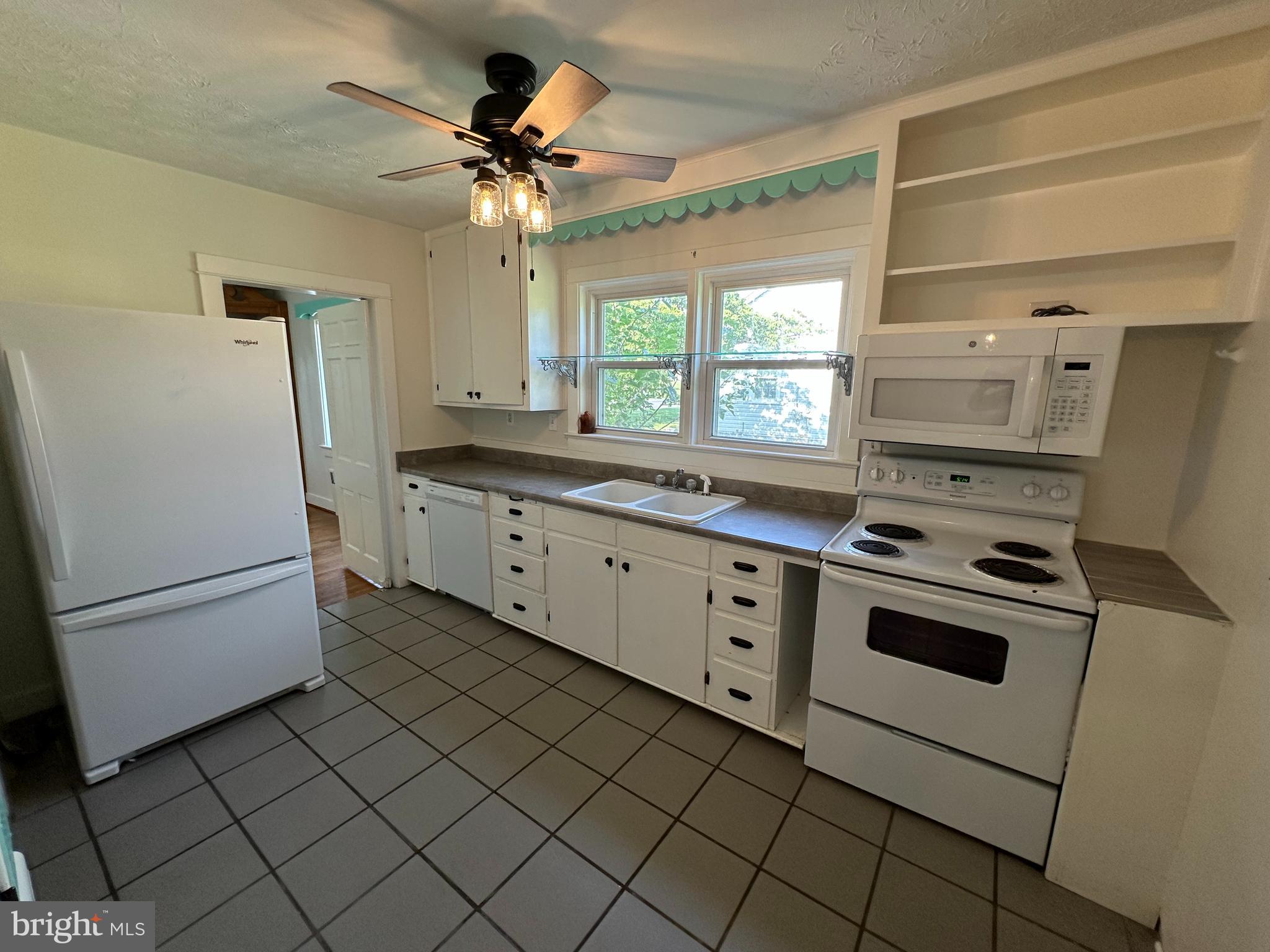 2 Terrace Lane Luray, VA 22835 - Photo 17 of 35 a kitchen with white cabinets and white appliances
