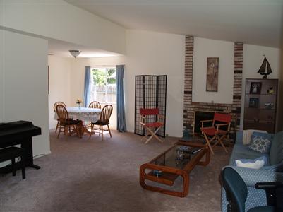 1560 Cunningham Way Santa Rosa, CA 95403 - Photo 3 of 8 a living room with furniture and a fireplace