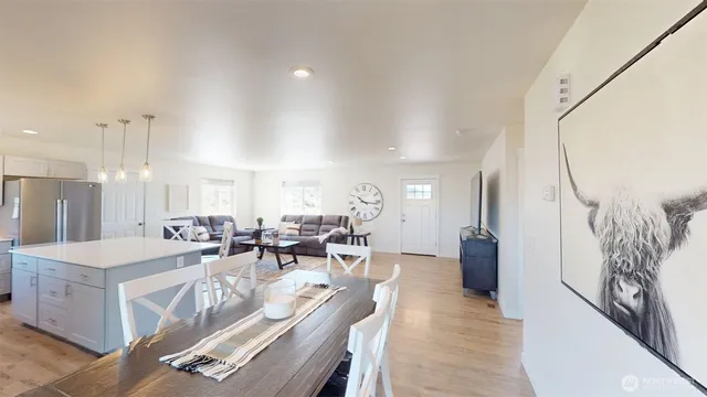 a very nice looking dining room with a large window