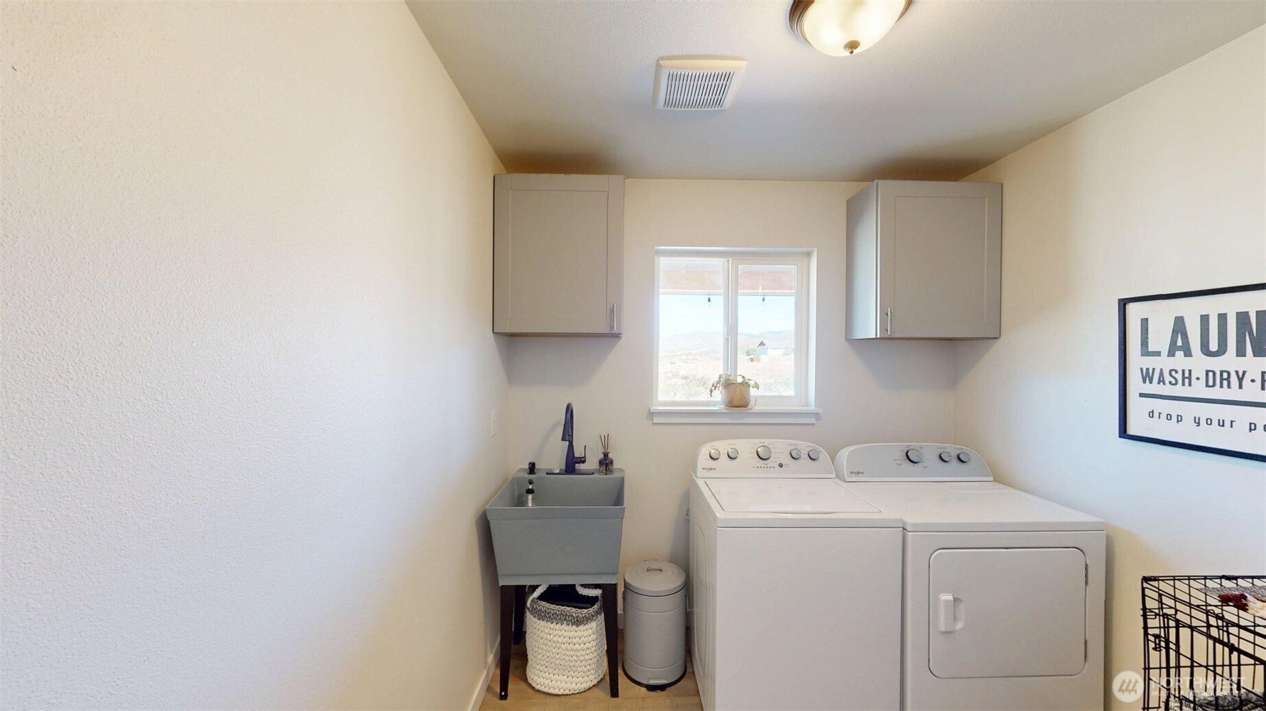 212 Hubbard Road Riverside, WA 98849 - Photo 18 of 39 a utility room with a sink dryer and washer