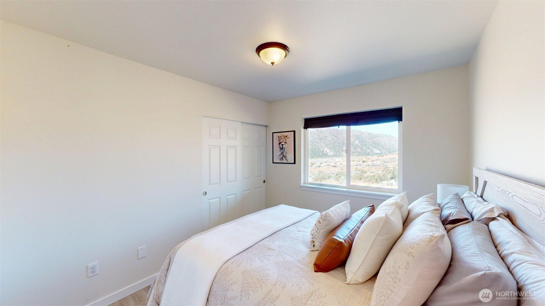 212 Hubbard Road Riverside, WA 98849 - Photo 19 of 39 a bedroom with a bed and a window