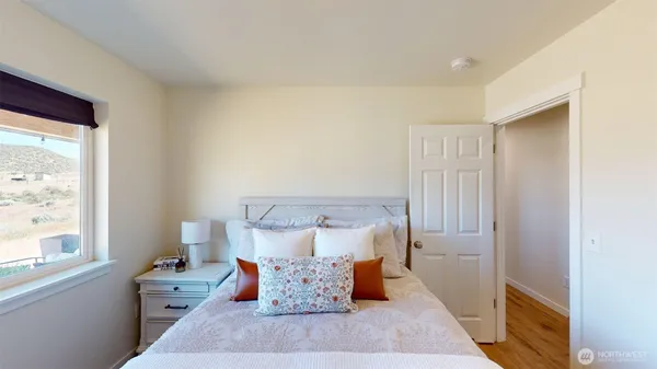 a bed room with a bed and a window