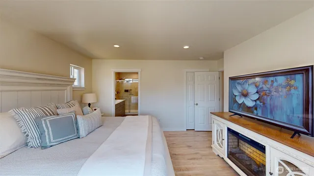 a room with furniture and painting on the wall