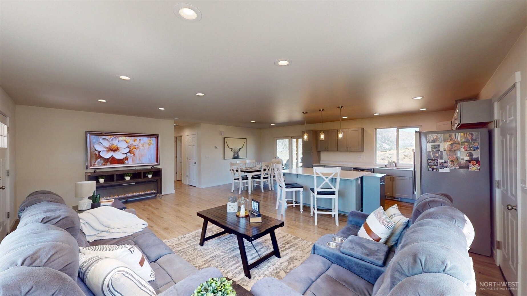 212 Hubbard Road Riverside, WA 98849 - Photo 7 of 39 a living room with furniture kitchen view and a large window