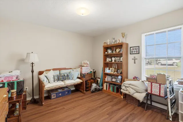 a bathroom with a toilet and a shower curtain