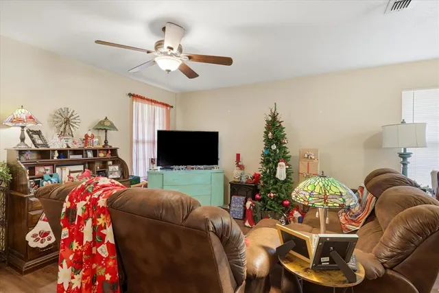 a room with kitchen island a stove a sink and a refrigerator