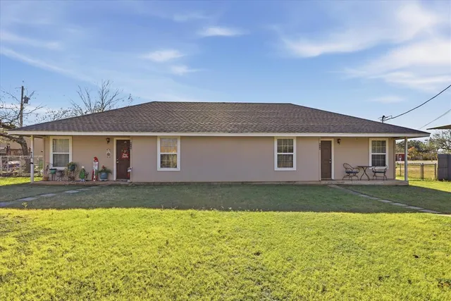 a front view of house with an outdoor space