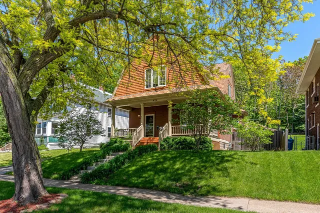 a front view of a house with garden