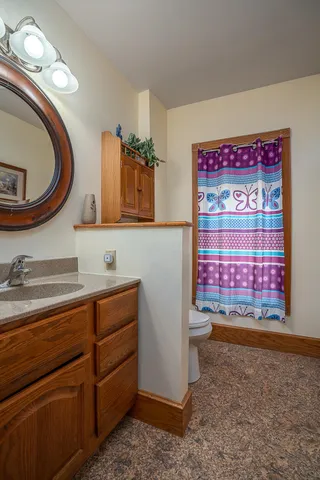 a bathroom with a toilet and a sink