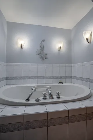 a bathroom with a sink and cabinets