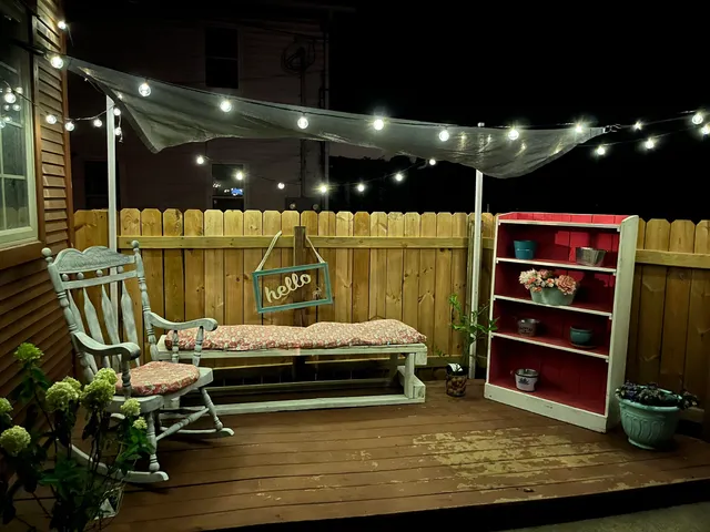 a living room with furniture a flat screen tv and gym equipment