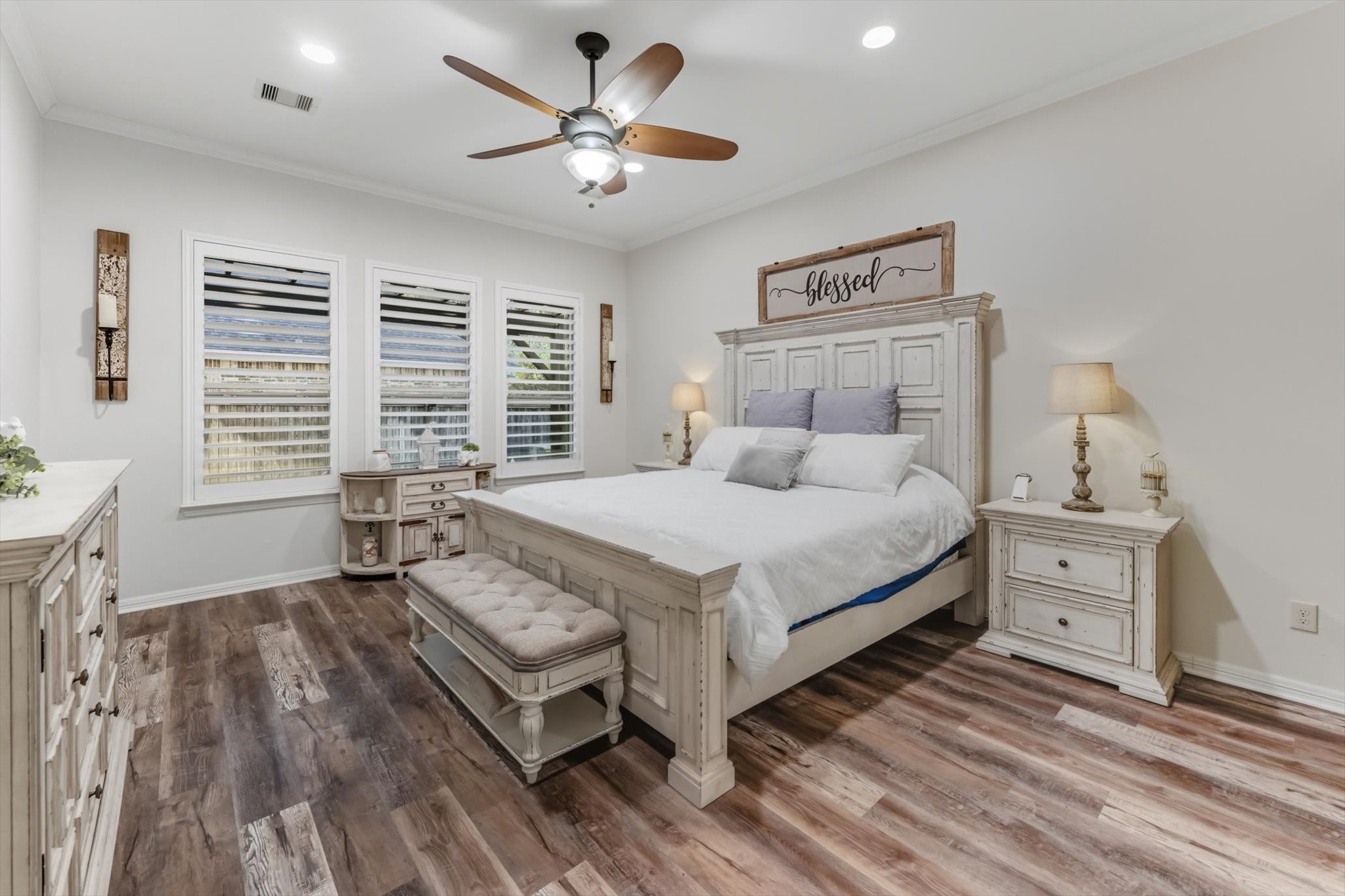 103 Fox Rindle Road Montgomery, TX 77316 - Photo 15 of 44 Spacious primary suite is highlighted by rich flooring and neutral tones that gives both comfort and character, with a serene and distinctly elevated feel.
