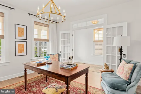 a living room with furniture a table and a window
