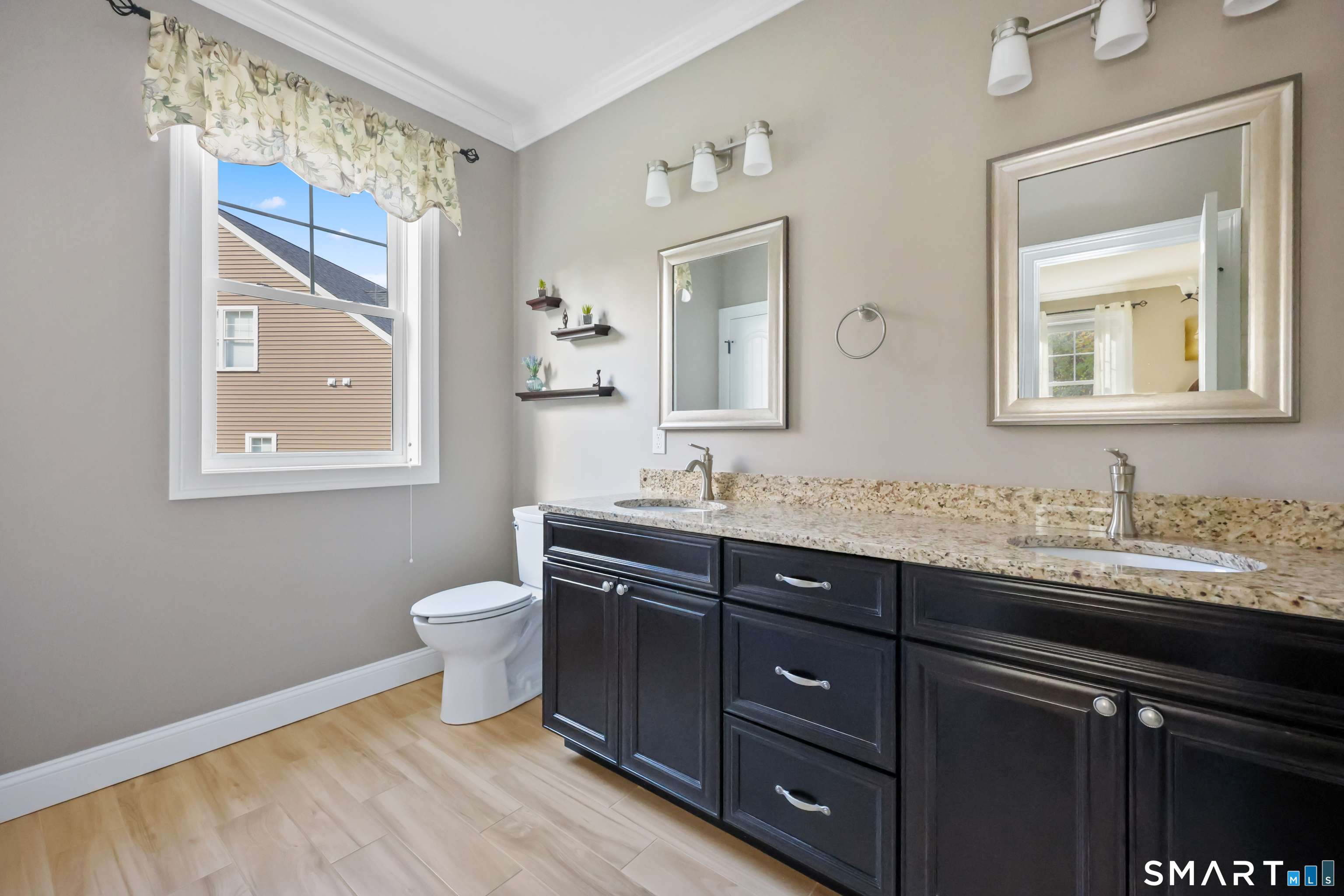 20 Lakeview Estates, Unit 20 Middlefield, CT 06455 - Photo 19 of 36 a bathroom with a toilet sink and mirror