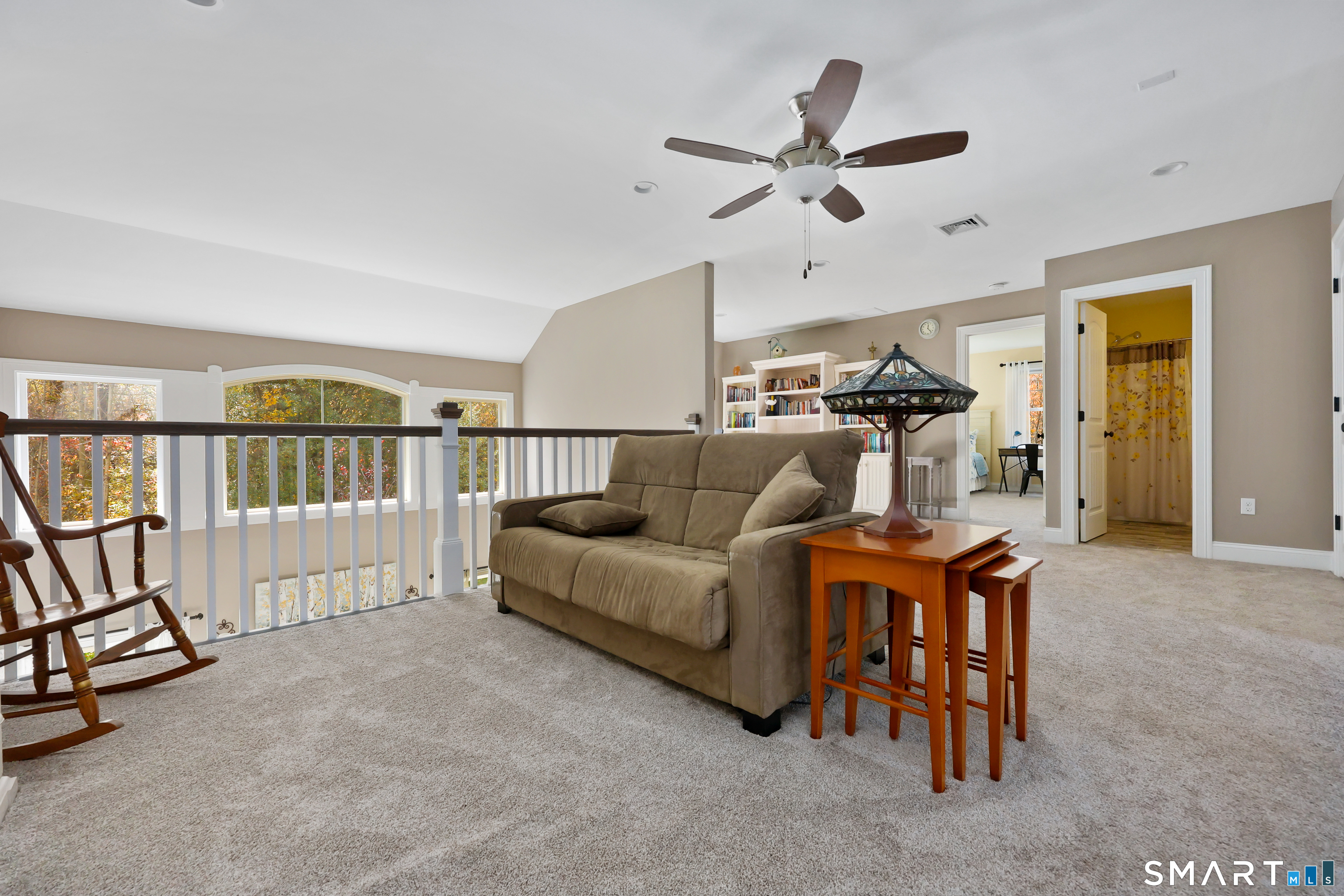 20 Lakeview Estates, Unit 20 Middlefield, CT 06455 - Photo 24 of 36 a living room with furniture a ceiling fan and a rug