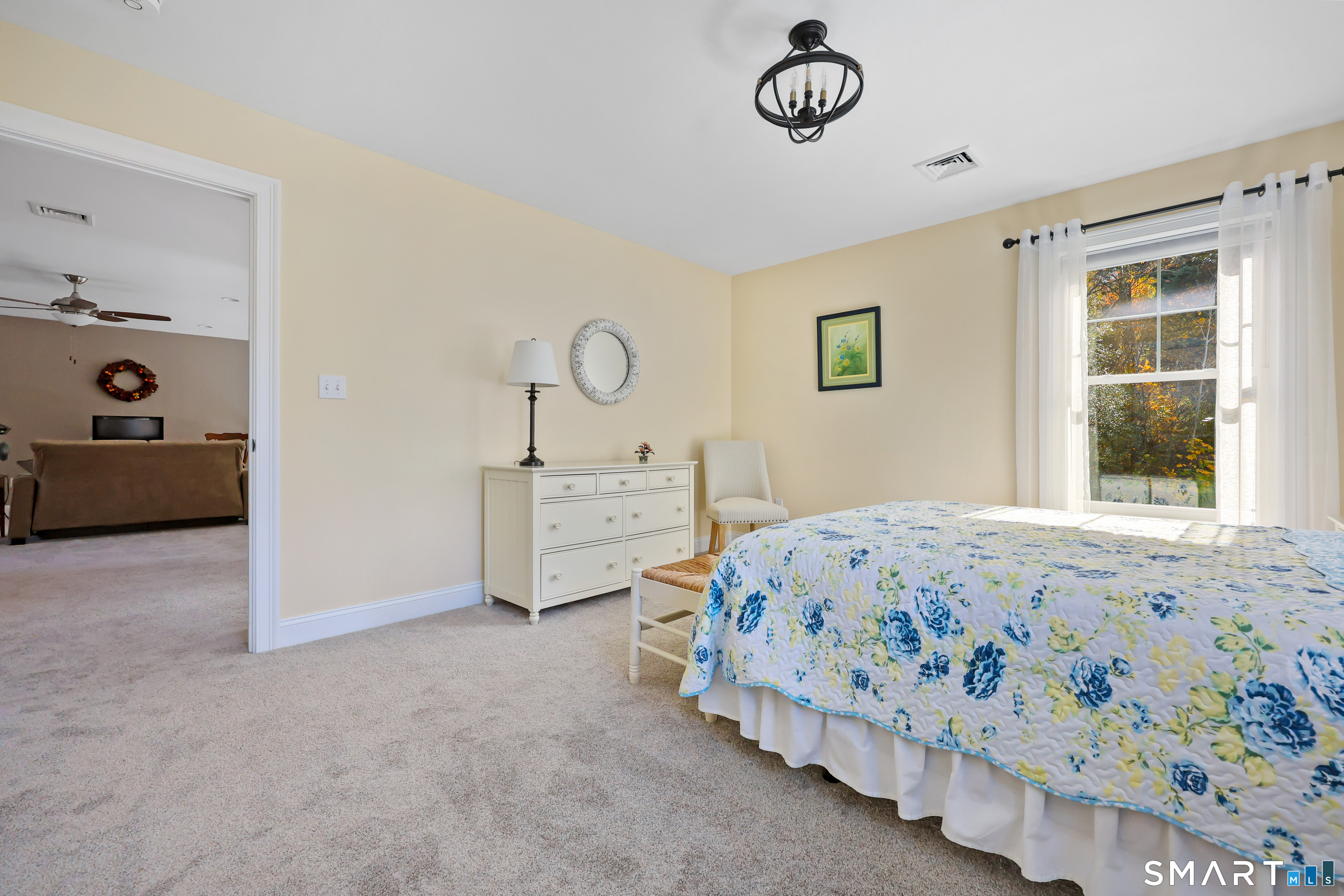 20 Lakeview Estates, Unit 20 Middlefield, CT 06455 - Photo 28 of 36 a bedroom with a bed and a window