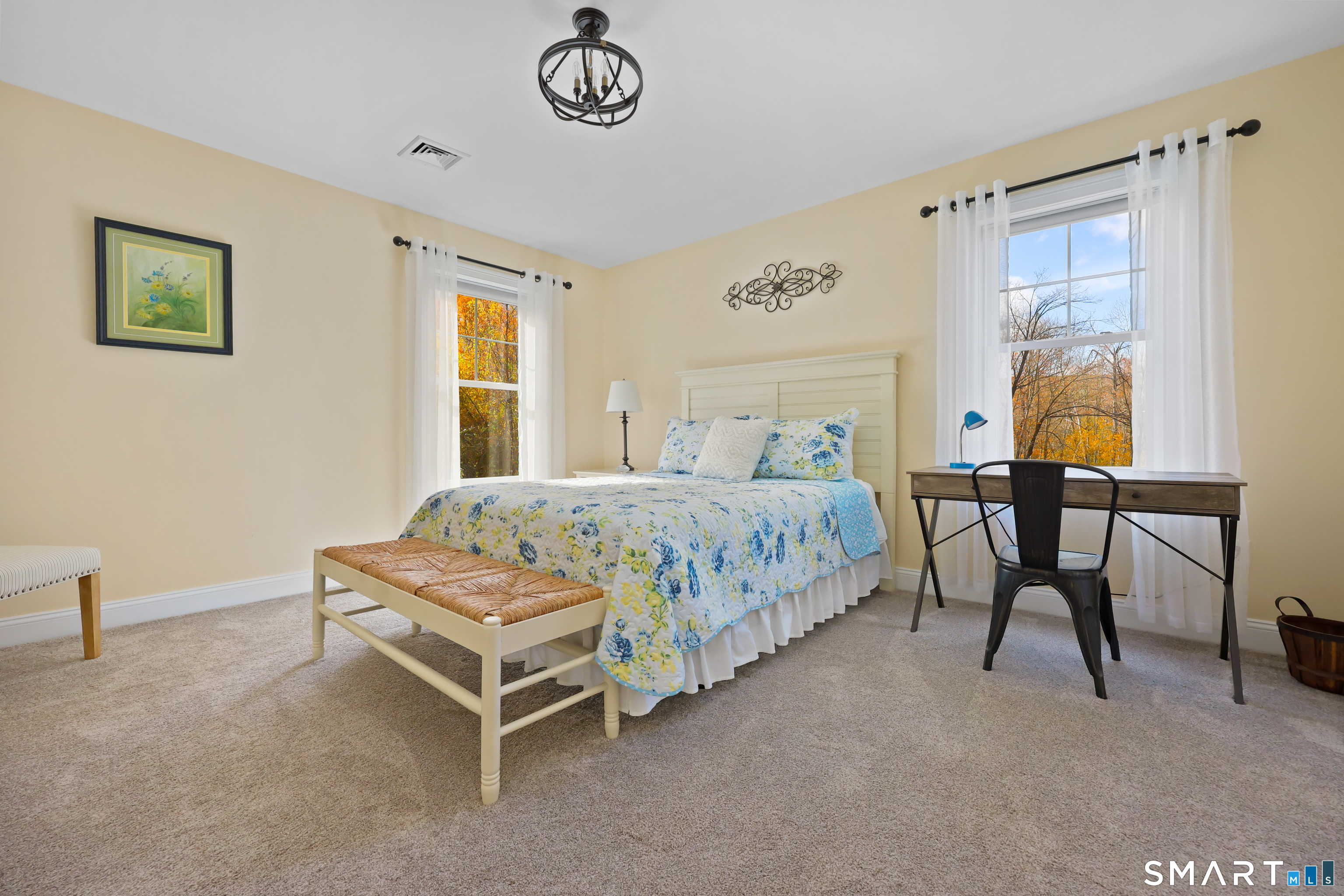 20 Lakeview Estates, Unit 20 Middlefield, CT 06455 - Photo 29 of 36 a bedroom with a bed and a table in it