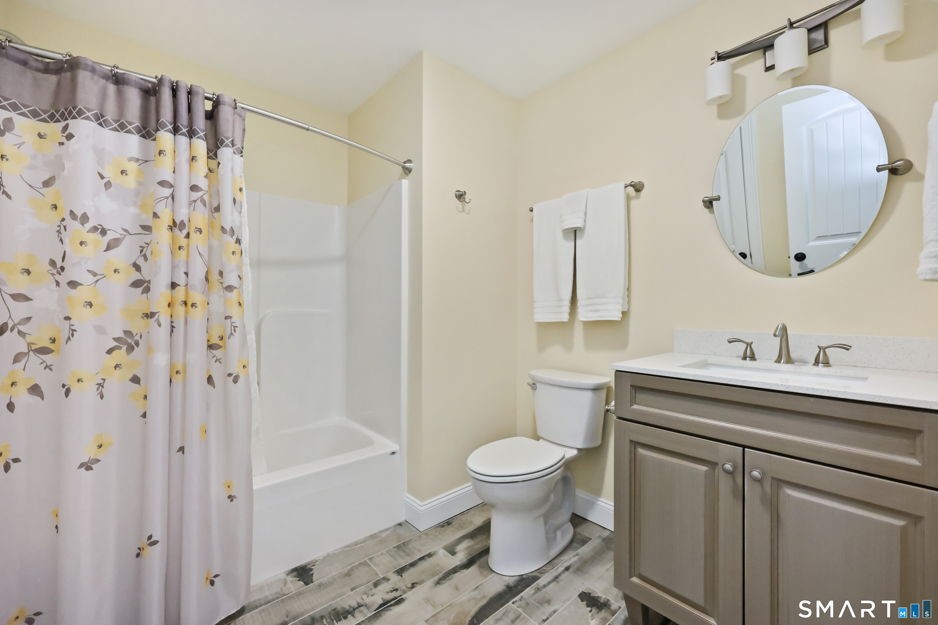 20 Lakeview Estates, Unit 20 Middlefield, CT 06455 - Photo 30 of 36 a bathroom with a sink toilet and shower