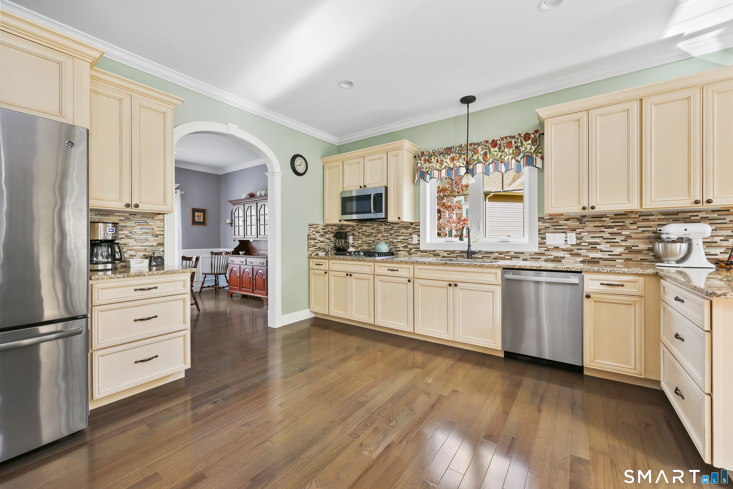 20 Lakeview Estates, Unit 20 Middlefield, CT 06455 - Photo 3 of 36 a kitchen with white cabinets and white appliances