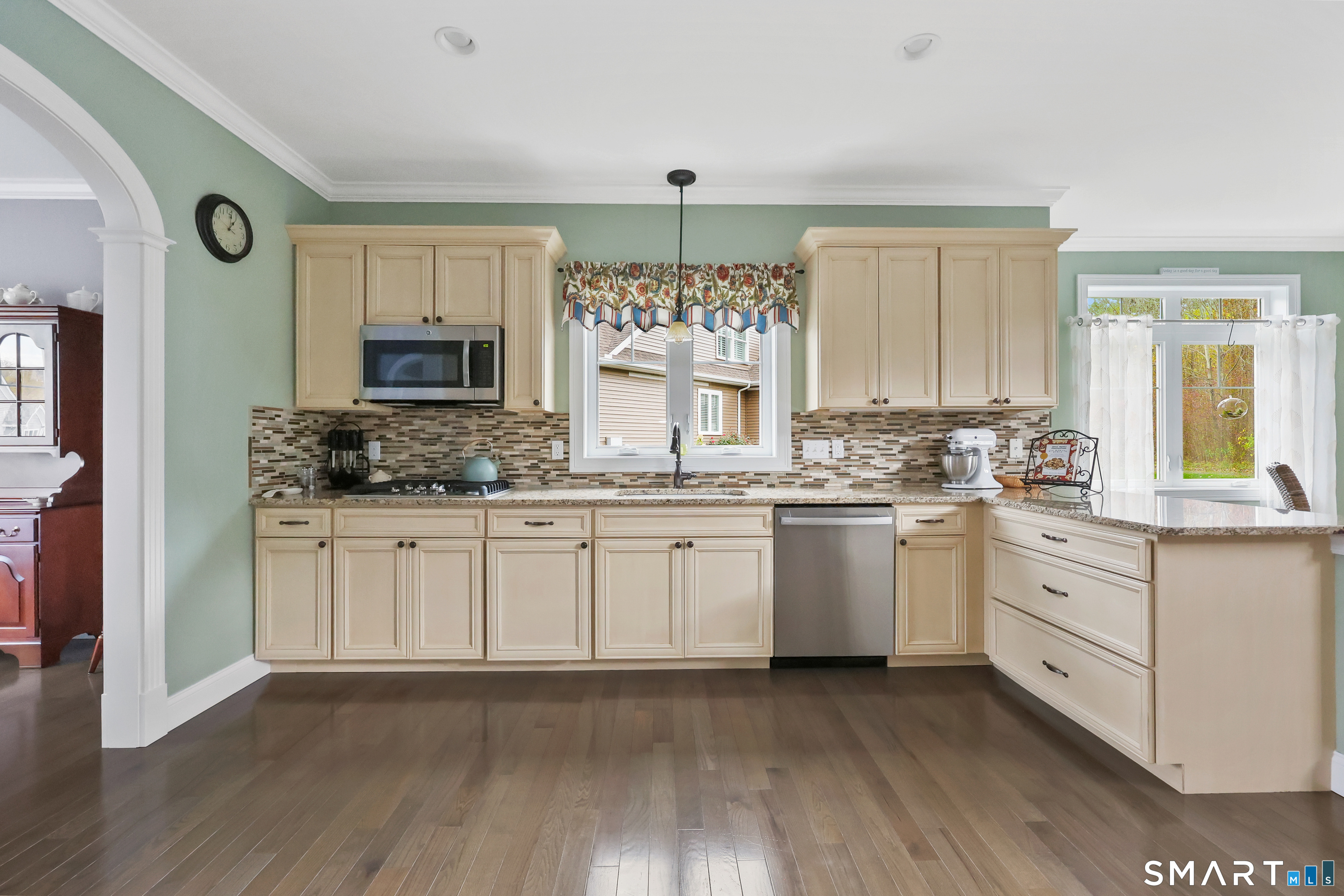 20 Lakeview Estates, Unit 20 Middlefield, CT 06455 - Photo 7 of 36 a kitchen with granite countertop white cabinets and white appliances