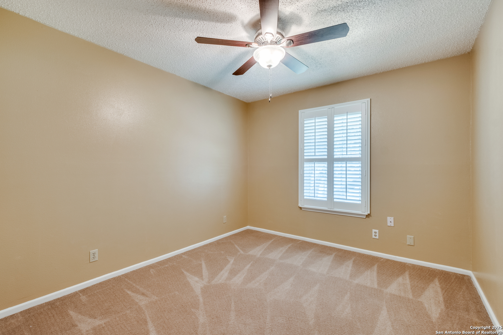 6106 Vance Jackson Road, Unit 46 San Antonio, TX 78230 - Photo 11 of 25 an empty room with windows and fan