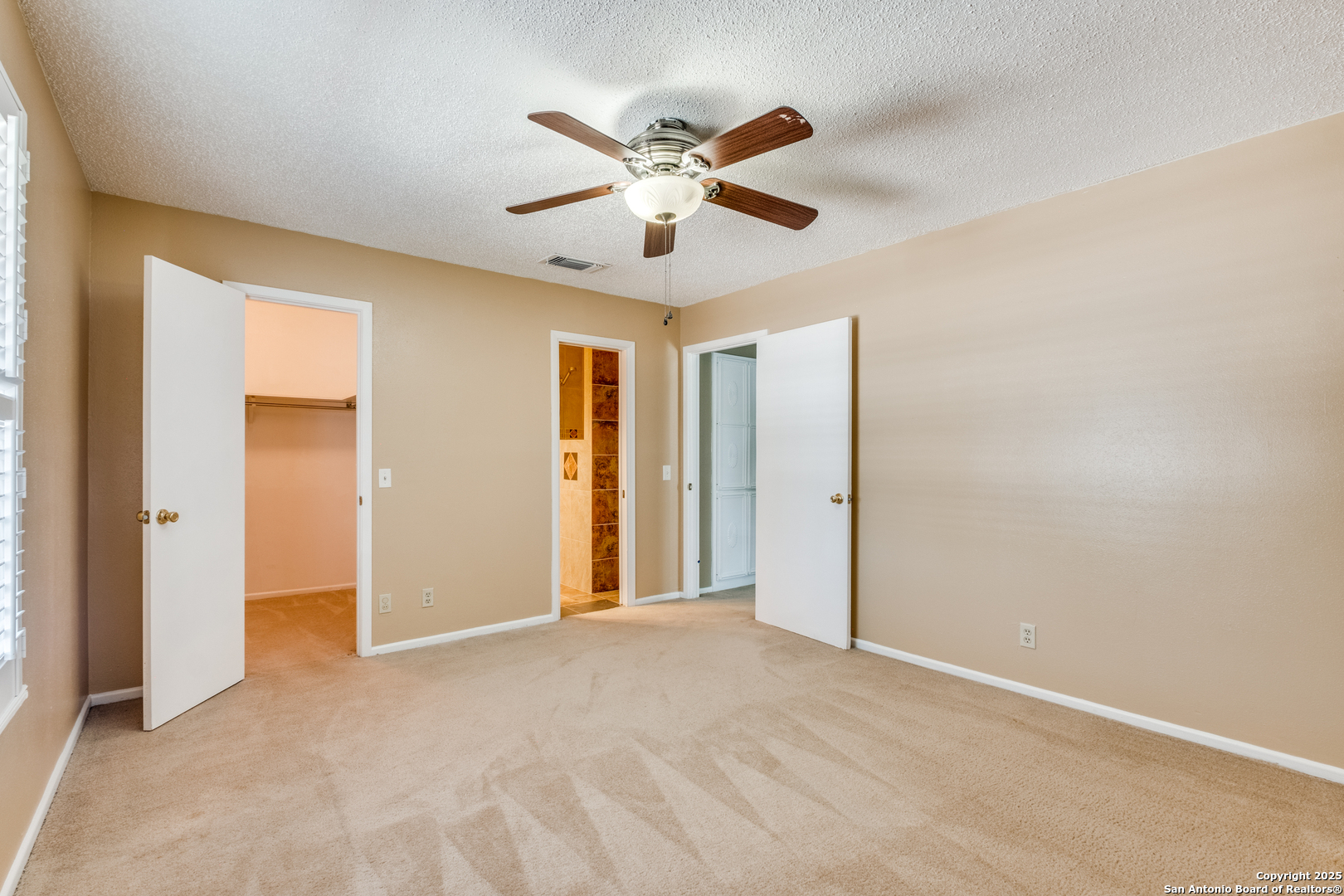 6106 Vance Jackson Road, Unit 46 San Antonio, TX 78230 - Photo 15 of 25 a view of an empty room with window and a ceiling fan