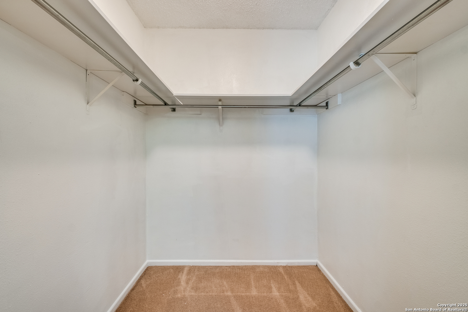 6106 Vance Jackson Road, Unit 46 San Antonio, TX 78230 - Photo 16 of 25 a view of a room with racks on the wall