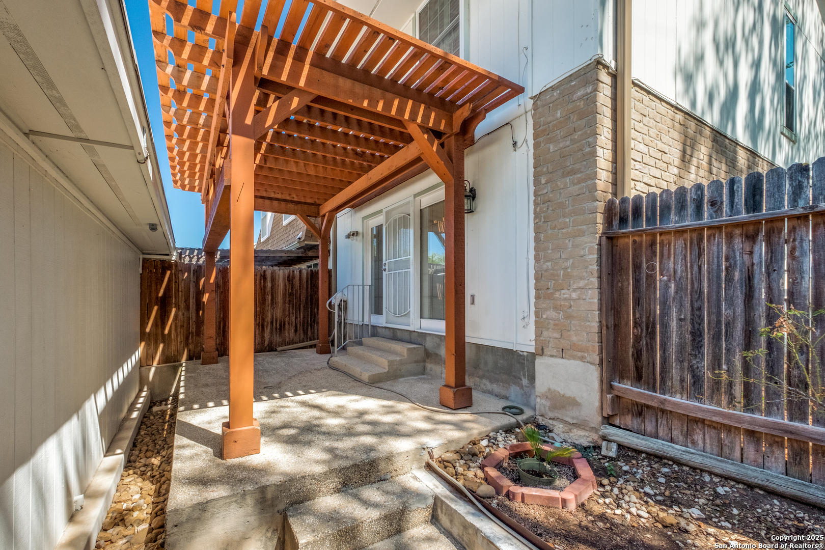 6106 Vance Jackson Road, Unit 46 San Antonio, TX 78230 - Photo 22 of 25 a view of a house with a backyard