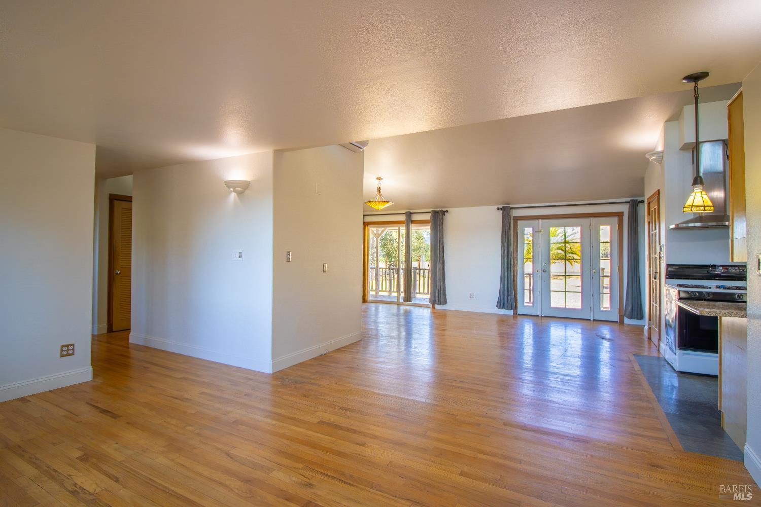 2901-2903 Rd I, Unit AC Redwood Valley, CA 95470 - Photo 33 of 61 Living room with view to dining room and kitchen.