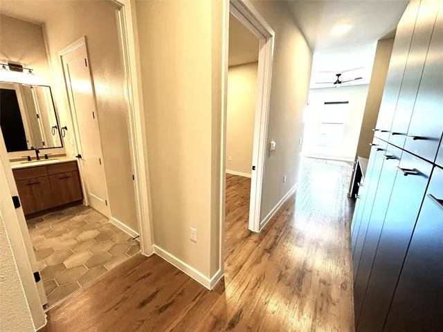 a view of a kitchen from a hallway
