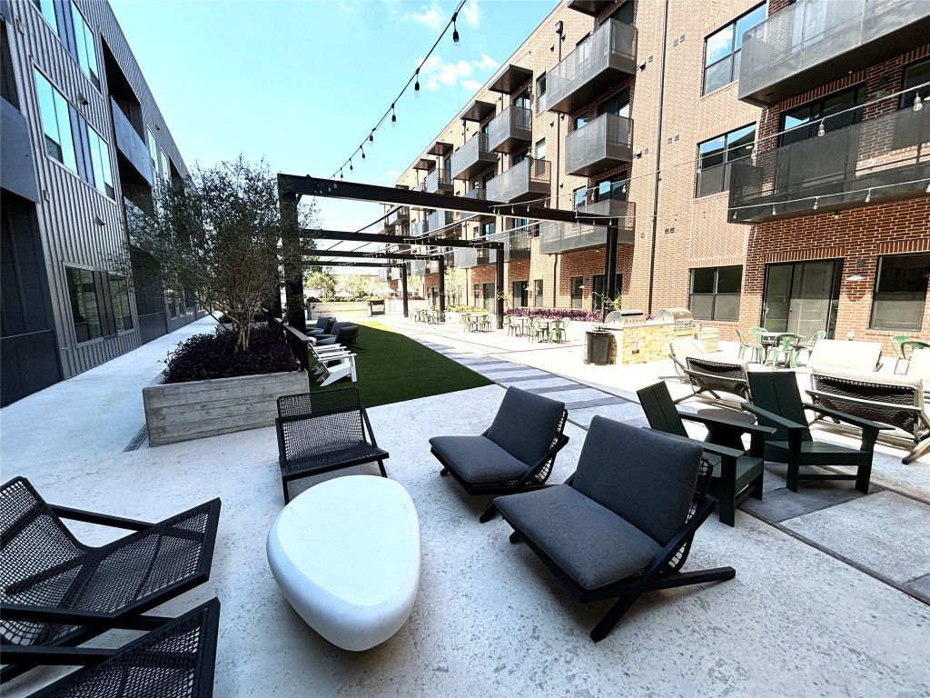 4510 Terry-O Lane, Unit 406 Austin, TX 78745 - Photo 23 of 34 a view of a patio with swimming pool and sitting area