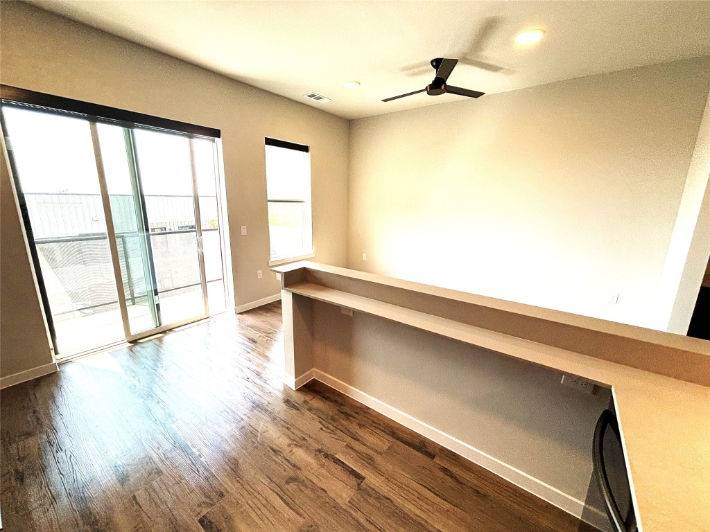 4510 Terry-O Lane, Unit 406 Austin, TX 78745 - Photo 10 of 34 a view of an empty room with wooden floor and a window