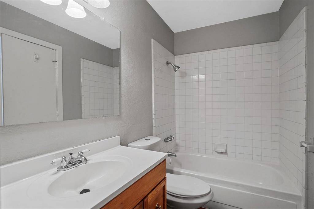 2156 Fleur De Lis Court Arlington, TX 76012 - Photo 11 of 16 a bathroom with a sink toilet and shower