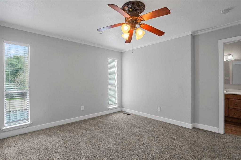 2156 Fleur De Lis Court Arlington, TX 76012 - Photo 13 of 16 an empty room with closet and a chandelier fan